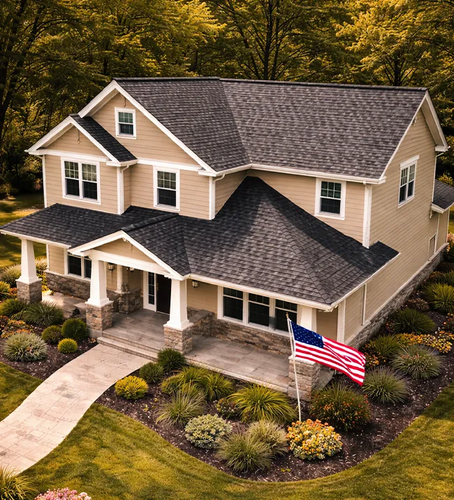 House with American flag and roof - Roofing Contractor