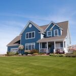 beautiful home with new wall siding with a green grass on front
